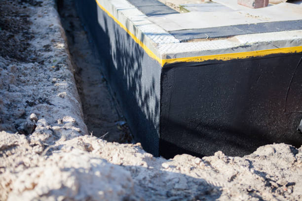 Professional Waterproofing technician working in Freeport, NY